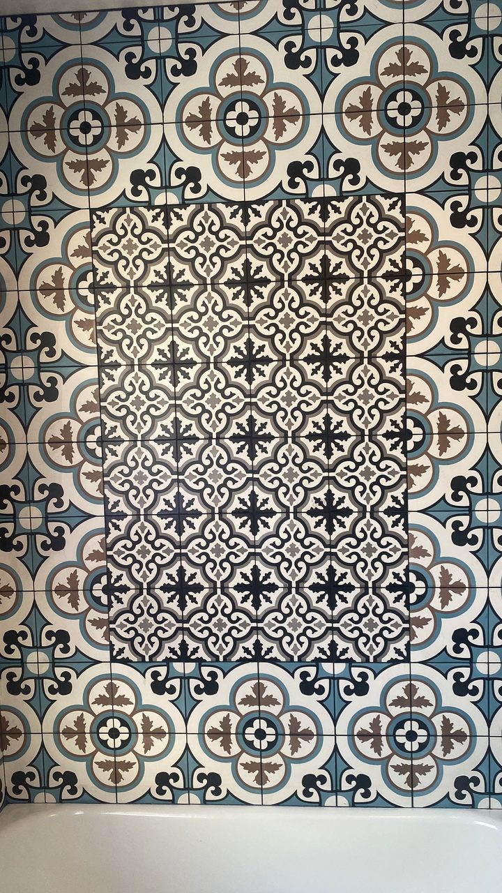 Patterned blue and white tile accent wall